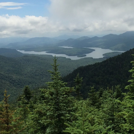 Water amid trees and mountains Water amid trees and mountains