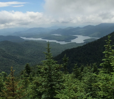 Water amid trees and mountains Water amid trees and mountains